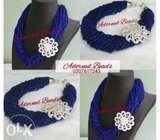 Royal blue seed bead necklace with a brooch